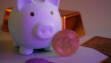 Piggy bank with bitcoin and gold bars