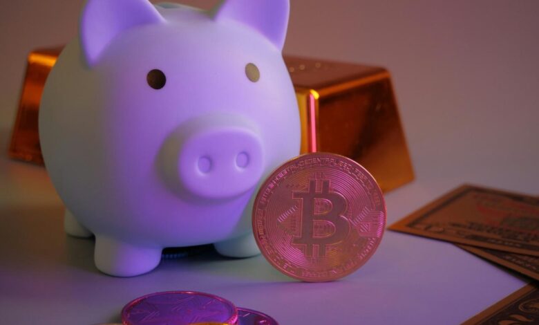 Piggy bank with bitcoin and gold bars